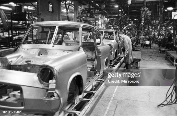 New Ford Anglia cars coming off the production line at the new Ford paint, trim and assembly plant in Dagenham, Essex, 27th October 1959.