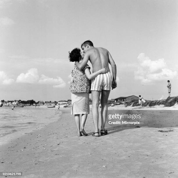 Pop singer Marty Wilde and his 19-year-old wife Joyce on the beach at Shell Bay, Dorset. They are living in Sandbanks while Marty is appearing at the...