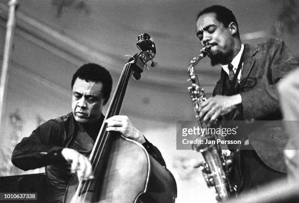 American jazz saxophonist Eric Dolphy performing with American jazz bassist Charles Mingus at Odd Fellow Palaeet Copenhagen Denmark 1964.