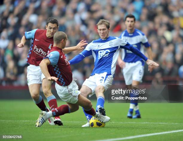 Luke Young of Aston Villa tackles Alexander Hleb of Birmingham City during the Barclays Premier League match between Aston Villa and Birmingham City...