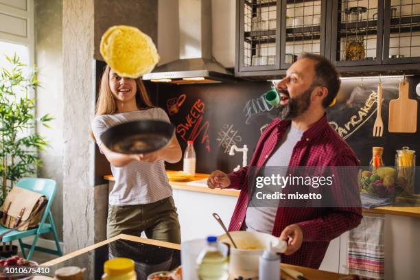 fun in the kitchen - making pancakes stock pictures, royalty-free photos & images