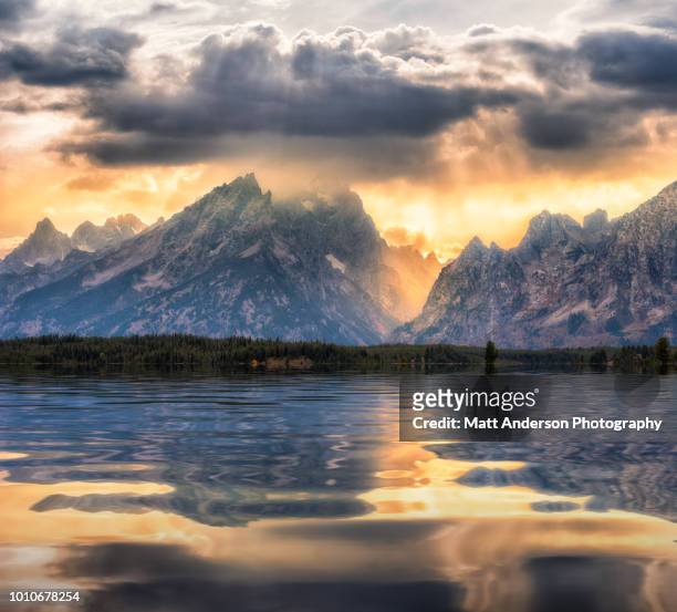 atmospheric reflections at grand tetons - grand teton national park sunset stock pictures, royalty-free photos & images