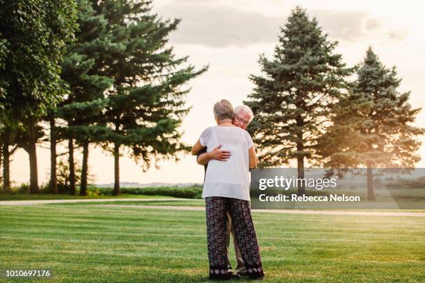 senior man and woman dancing - slow dancing stock pictures, royalty-free photos & images