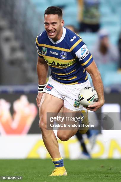 Corey Norman of the Eels scores a try during the round 21 NRL match between the Parramatta Eels and the Gold Coast Titans at ANZ Stadium on August 4,...