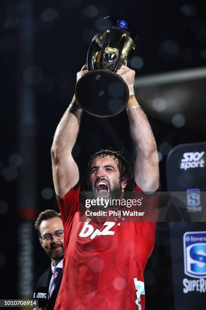 Sam Whitelock of the Crusaders lifts the Super Rugby trophy after winning the Super Rugby Final match between the Crusaders and the Lions at AMI...