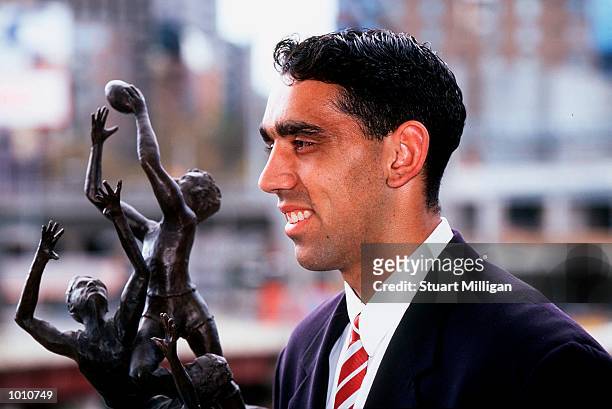 Adam Goodes, of the Sydney Swans, Winner of the 1999 Norwich Rising Star, with his trophy. The Awards was presented at the Palladium, Crown Casino,...
