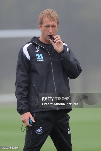 Swansea City's Manager Graham Potter watches his player train during the Swansea City Training Session at The Fairwood Training Ground on August 02,...