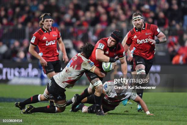 Matt Todd of the Crusaders offloads the ball during the Super Rugby Final match between the Crusaders and the Lions at AMI Stadium on August 4, 2018...