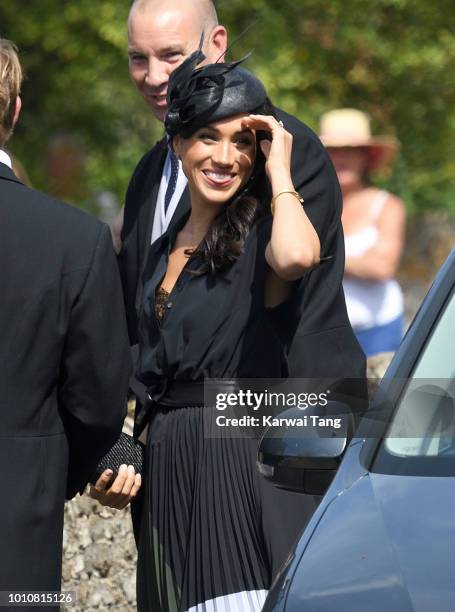 Meghan, Duchess of Sussex attends the wedding of Daisy Jenks and Charlie Van Straubenzee at Saint Mary The Virgin Church on August 4, 2018 in...