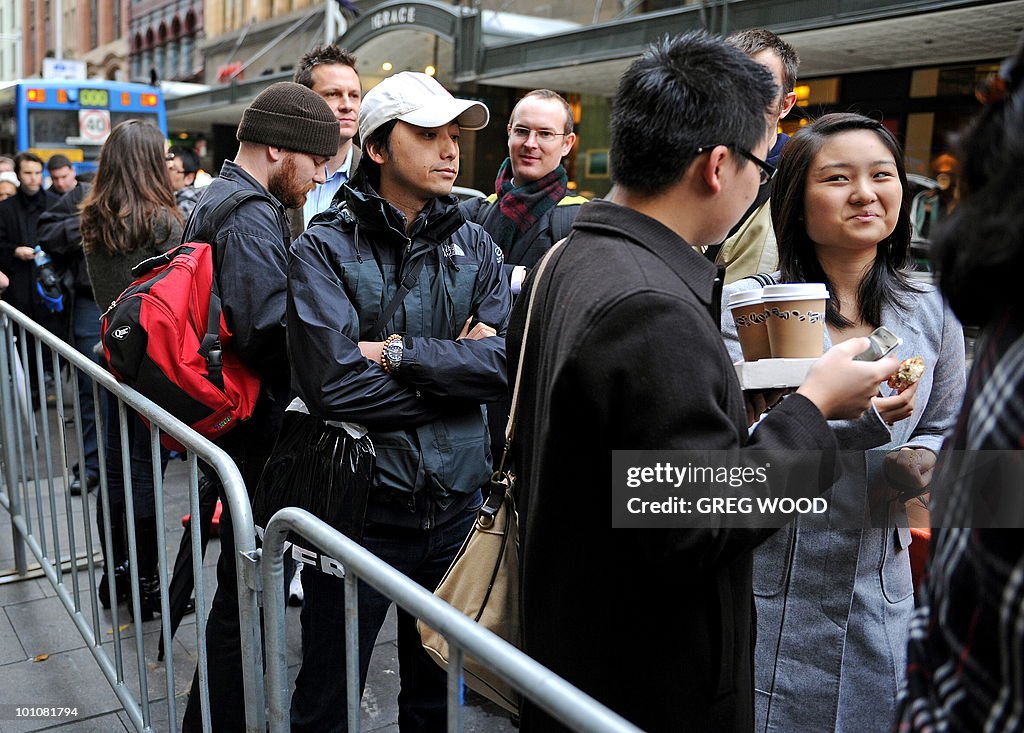 Sydney residents wait in line outside Ap