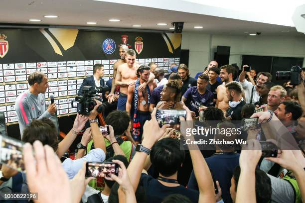 Players of Paris Saint Germain celebrate the champion at press conference room after the match between Paris Saint Germain and Monaco at Shenzhen...