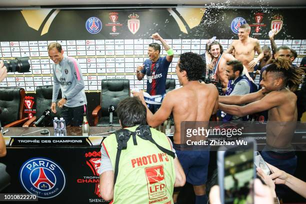 Players of Paris Saint Germain celebrate the champion at press conference room after the match between Paris Saint Germain and Monaco at Shenzhen...