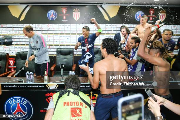 Players of Paris Saint Germain celebrate the champion at press conference room after the match between Paris Saint Germain and Monaco at Shenzhen...