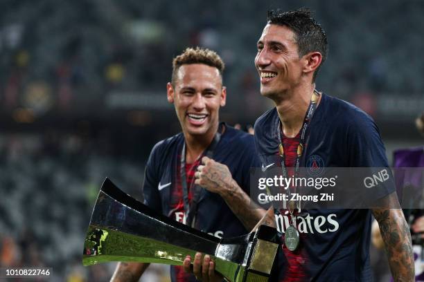 Neymar and Angel Di Maria of Paris Saint-Germain celebrate with trophy after winning the French Trophy of Champions football match between AS Monaco...