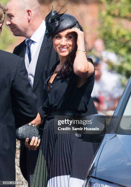 Meghan, Duchess of Sussex attends the wedding of Charlie Van Straubenzee on August 4, 2018 in Frensham, United Kingdom. Prince Harry attended the...