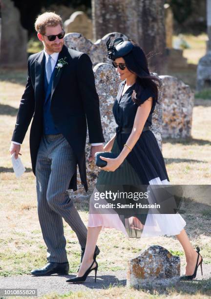Prince Harry, Duke of Sussex and Meghan, Duchess of Sussex attend the wedding of Charlie Van Straubenzee on August 4, 2018 in Frensham, United...