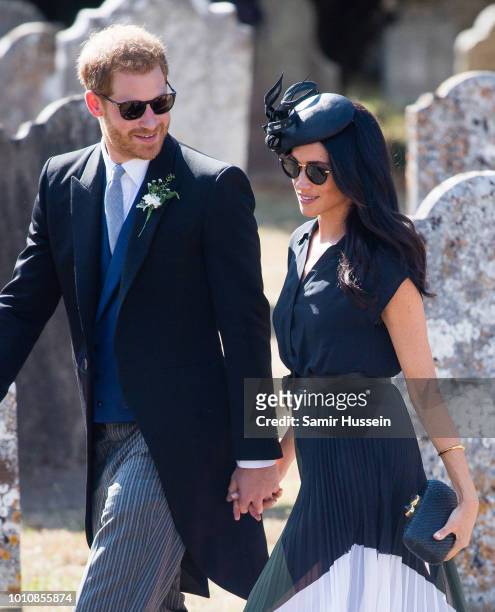 Prince Harry, Duke of Sussex and Meghan, Duchess of Sussex attend the wedding of Charlie Van Straubenzee on August 4, 2018 in Frensham, United...