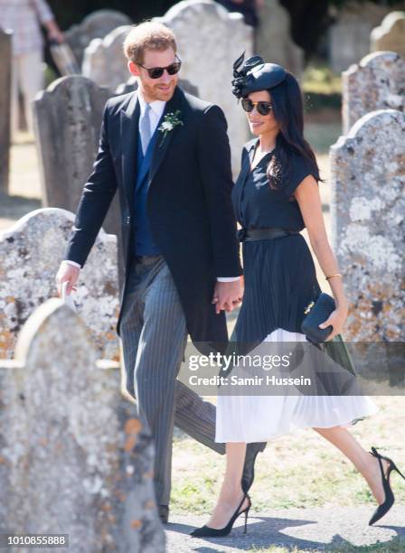 Prince Harry, Duke of Sussex and Meghan, Duchess of Sussex attend the wedding of Charlie Van Straubenzee on August 4, 2018 in Frensham, United...