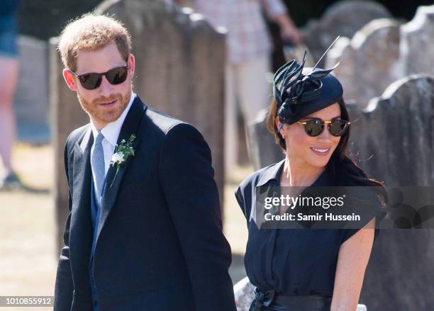 Prince Harry, Duke of Sussex and Meghan, Duchess of Sussex attend the wedding of Charlie Van Straubenzee on August 4, 2018 in Frensham, United...