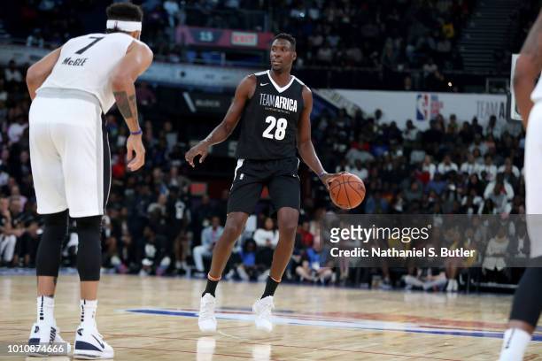 Ian Mahinmi of Team Africa handles the ball against Team World during the 2018 NBA Africa Game as part of the Basketball Without Borders Africa on...