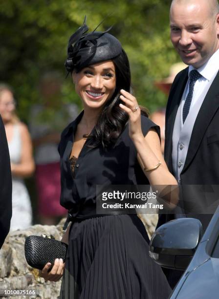 Meghan, Duchess of Sussex attends the wedding of Daisy Jenks and Charlie Van Straubenzee at Saint Mary The Virgin Church on August 4, 2018 in...