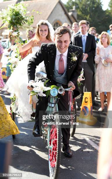 Daisy Jenks and Charlie Van Straubenzee depart after getting married at Saint Mary The Virgin Church on August 4, 2018 in Frensham, United Kingdom....