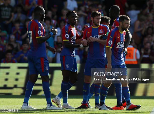 Crystal Palace's Wilfried Zaha receives congratulations from team mates after scoring his side's fourth goal during the pre-season friendly match at...