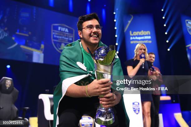 Mosaad 'MSDossary' Aldossary of Saudia celebrates with the trophy after victory in the Grand Final FIFA eWorld Cup 2018 at The O2 Arena on August 4,...