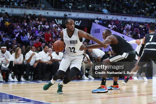 Khris Middleton of Team World handles the ball against Team Africa during the 2018 NBA Africa Game as part of the Basketball Without Borders Africa...