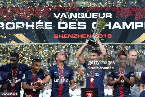 Players of Paris Saint-Germain celebrate with trophy after winning the French Trophy of Champions football match between AS Monaco and Paris...