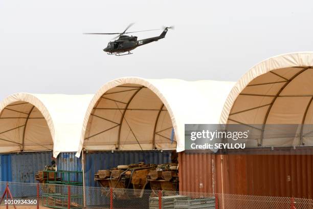 Canadian armed force helicopter of the United Nation peacekeeping mission in Mali Minusma, flies over the Castors Camp in Gao on August 3, 2018. -...