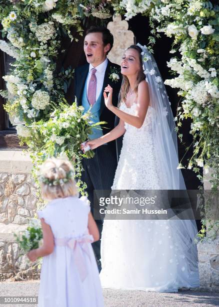 Bride Daisy Jenks and Charlie Van Straubenzee leave following their wedding on August 4, 2018 in Frensham, United Kingdom. Prince Harry attended the...
