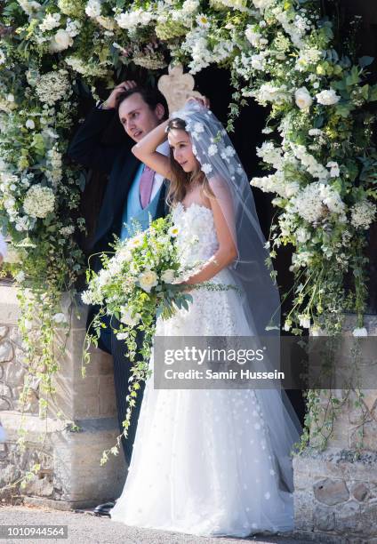 Bride Daisy Jenks and Charlie Van Straubenzee leave following their wedding on August 4, 2018 in Frensham, United Kingdom. Prince Harry attended the...