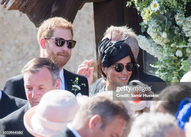 Prince Harry, Duke of Sussex and Meghan, Duchess of Sussex attend the wedding of Charlie Van Straubenzee on August 4, 2018 in Frensham, United...