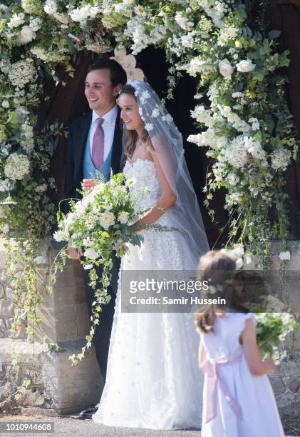 Bride Daisy Jenks and Charlie Van Straubenzee leave following their wedding on August 4, 2018 in Frensham, United Kingdom. Prince Harry attended the...