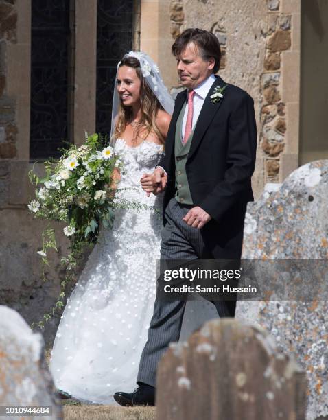 Bride Daisy Jenks attends the wedding of Charlie Van Straubenzee on August 4, 2018 in Frensham, United Kingdom. Prince Harry attended the same prep...