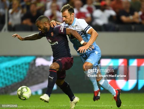 Alex Lacazette of Arsenal challenged by Stefan Radu of Lazio during the Pre-season friendly between Arsenal and SS Lazio on August 4, 2018 in...