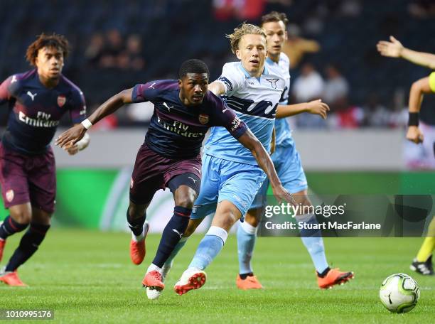 Ainsley Maitland-Niles of Arsenal cjallenged by Lucas Leiva of Lazio during the Pre-season friendly between Arsenal and SS Lazio on August 4, 2018 in...