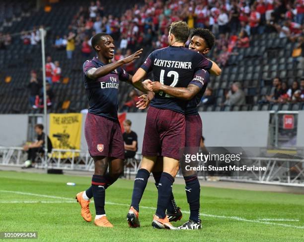 Reiss Nelson celebrates scoring the 1st Arsenal goal with Eddie Nketiah and Stephan Lichtsteiner during the Pre-season friendly between Arsenal and...