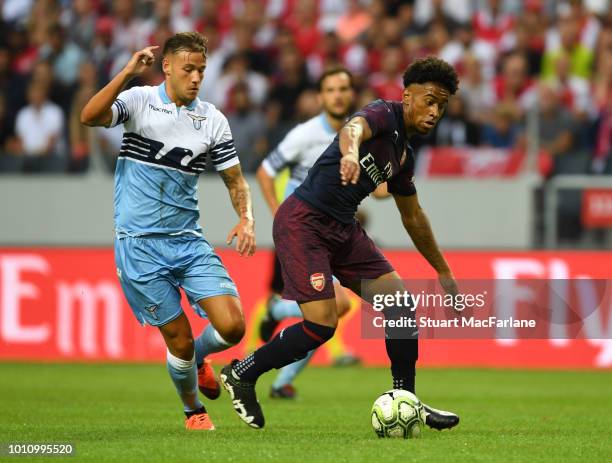 Reiss Nelson of Arsenal breaks past Alessandro Murgia of Lazio during the Pre-season friendly between Arsenal and SS Lazio on August 4, 2018 in...