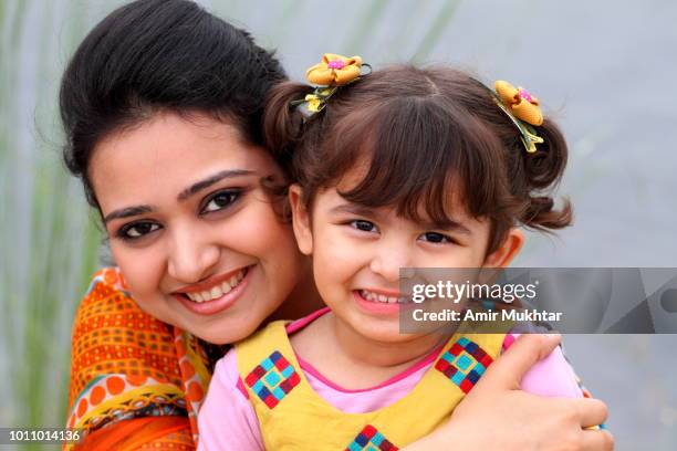 mother and daughter in happy mood - panyab pakistán fotografías e imágenes de stock