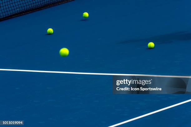 Tennis balls bounce and accumulate on a court during practice before a qualifier match at the Rogers Cup Saturday August 4, 2018 at Aviva Centre in...