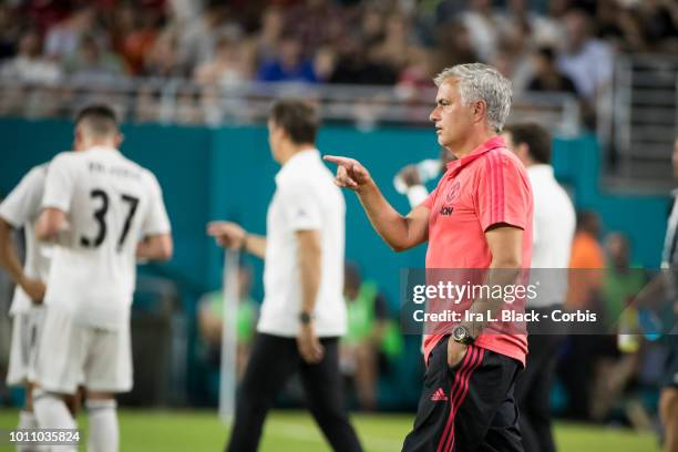 Head Coach Jose Mourinho of Manchester United goes onto the field to talk with players during a water break during the International Champions Cup...