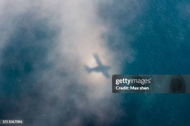 Plane Shadow Airplane Shadow In Clouds Photos and Premium High Res Pictures - Getty ...