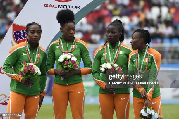 Blessing Okagbare, Oluwatobi Amusan, Rosemary Chukwuma and Joy Udo-Gabriel, Ivorian 4 × 100 metres relay silver medalists, celebrate during the...