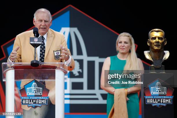 Jerry Kramer speaks as his daughter Alicia looks on during the 2018 NFL Hall of Fame Enshrinement Ceremony at Tom Benson Hall of Fame Stadium on...