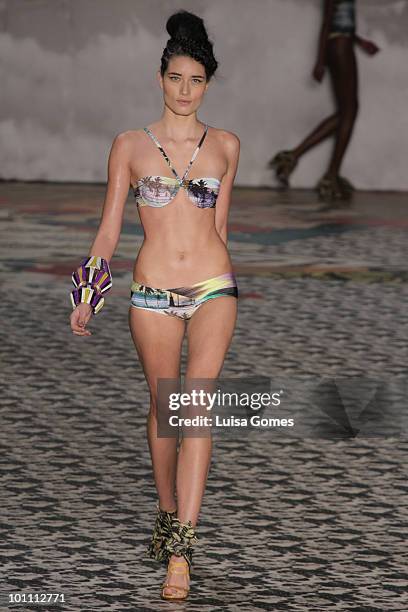 Model displays a design by Salinas during the first day of Fashion Rio Summer 2011 collection at Pier Maua on May 27, 2010 in Rio de Janeiro, Brazil.