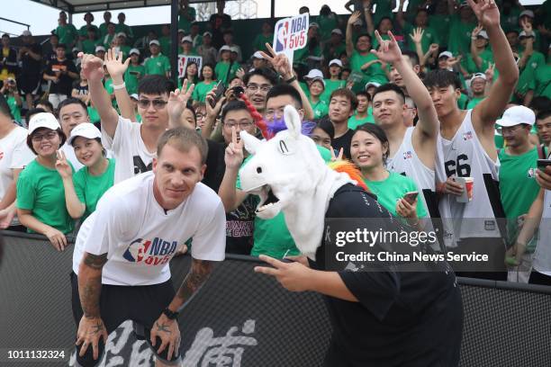 Former American NBA star Jason Williams poses with fans at the Nanjing 2018 NBA 5v5 competition on July 28, 2018 in Nanjing, Jiangsu Province of...