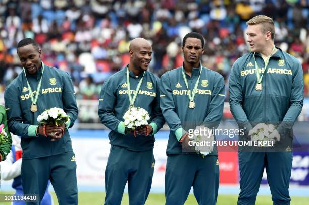 South African Men's 4 × 100 metres relay gold medalists pose during the medals presentation of the African Athletics Championship at the Stephen...