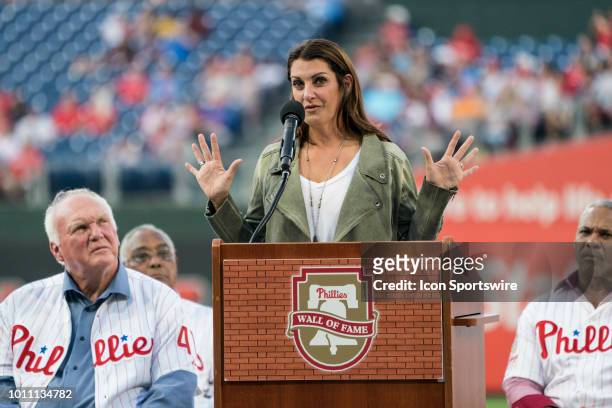 Brandy Halladay makes an acceptance speech into the Philadelphia Phillies Wall of Fame for her deceased husband Roy Halladay prior to a MLB game...